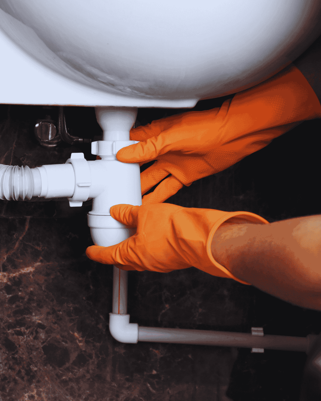 Boynton Beach plumber tightening a new water supply pipe fitting during a repair