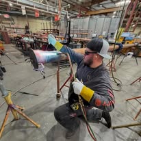 Licensed plumber welding a fabricated pipe assembly for a Boynton Beach plumbing installation