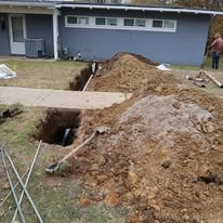 Sewer line excavation in a residential yard for lateral replacement in Boynton Beach